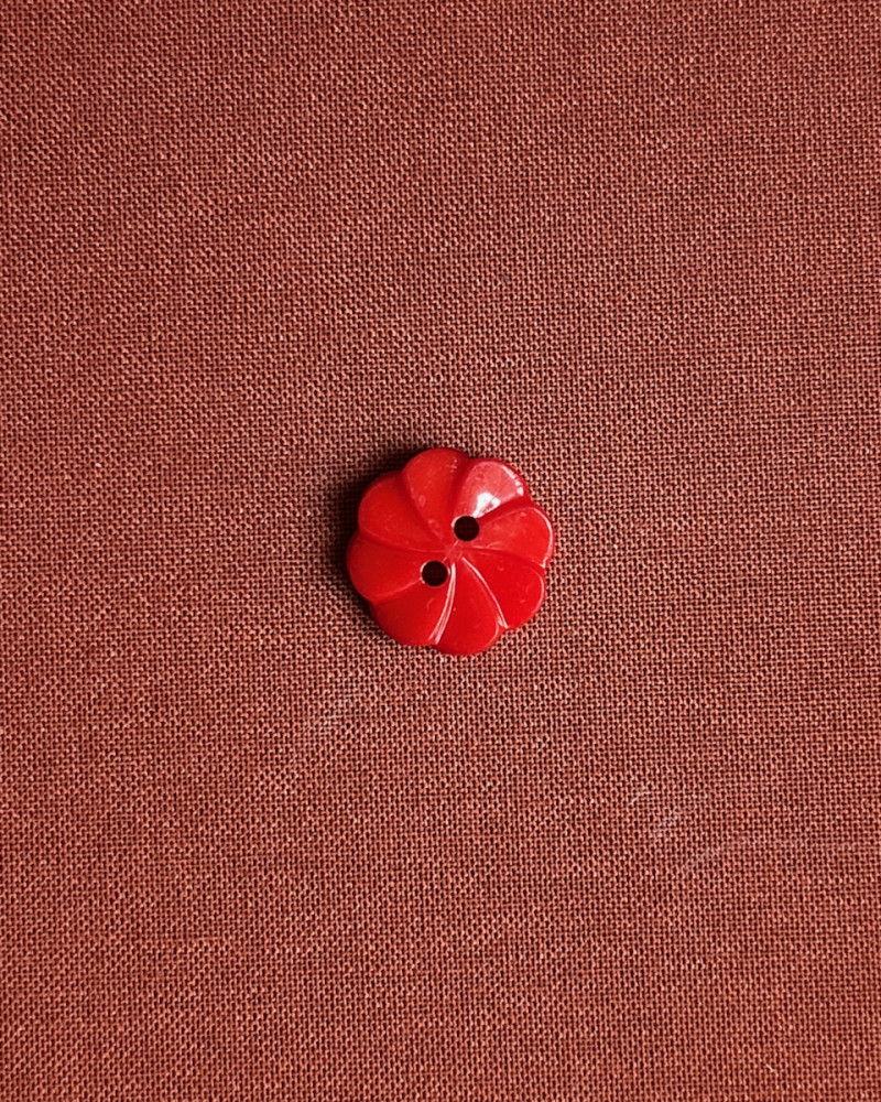 Button plastic flower shape...