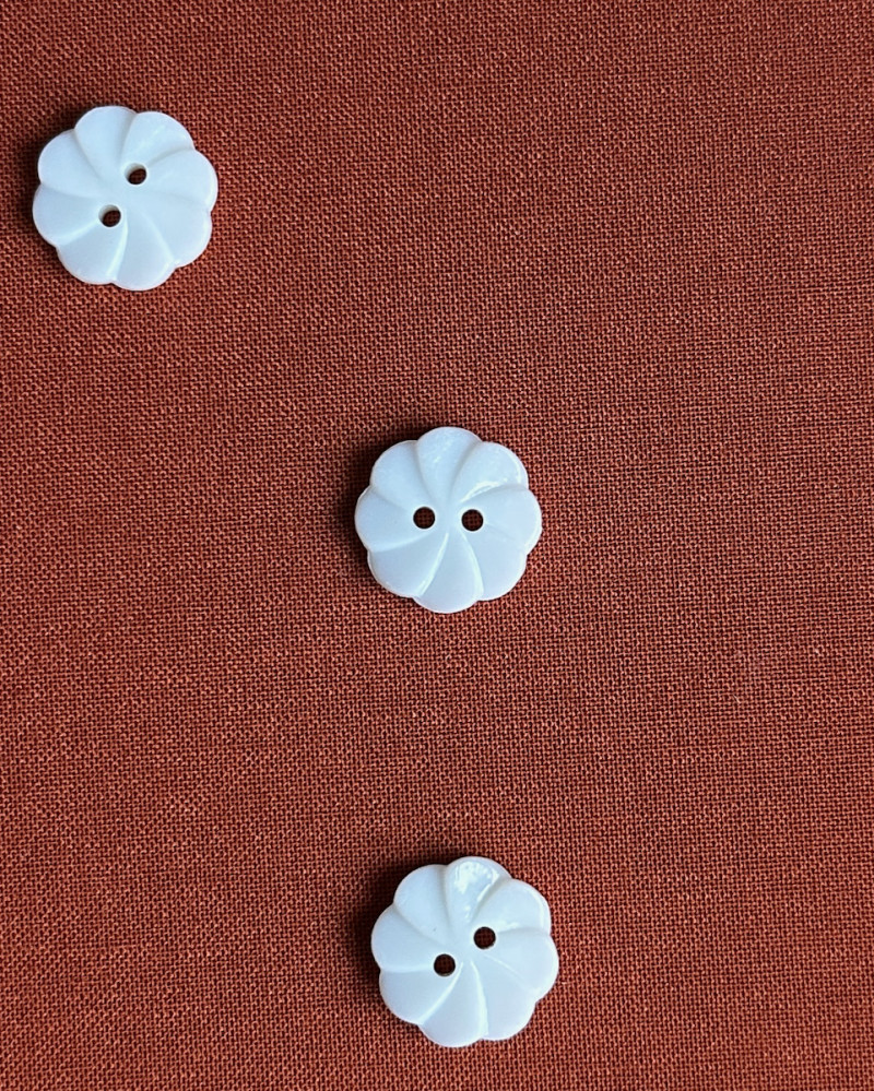 Button plastic flower shape...