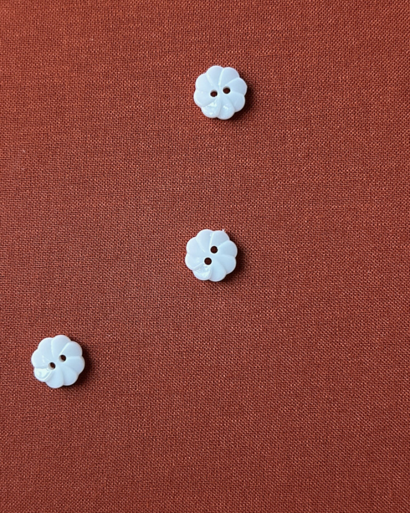 Button plastic flower shape...